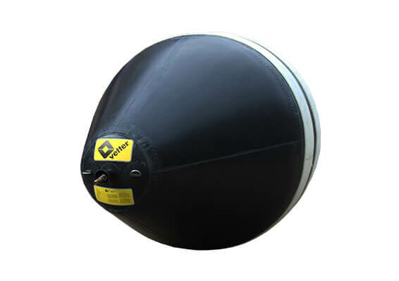 A black and white ball with a yellow sticker on it.